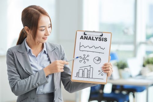 A girl holding a Analysis chart