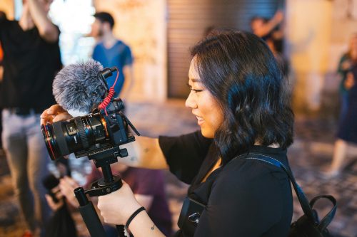 Photo showing a female holding a camera